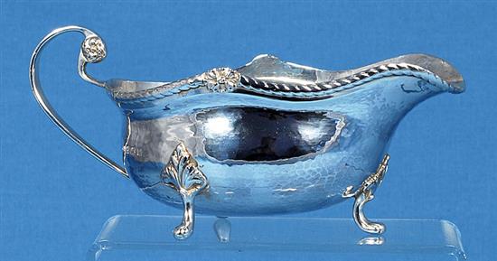A George V Arts & Crafts silver sauce boat, by Albert Edward Jones, length 185mm, weight 7.3oz/228grms.
